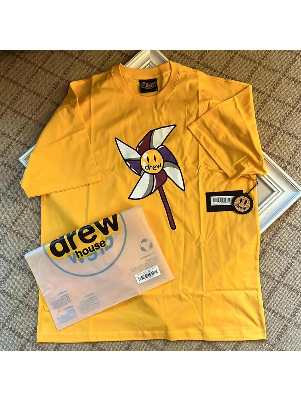 drewhouse Golden yellow short sleeve Tshirt w pinwheel design NWT L